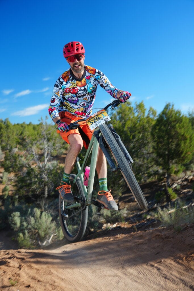 Roger flying through the air while racing 12 hours of mesa verde.